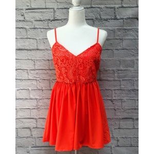 Orange lace top flowy romper